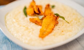 Piatto di riso in cagnone al pesce persico, piatto tipico di Lecco